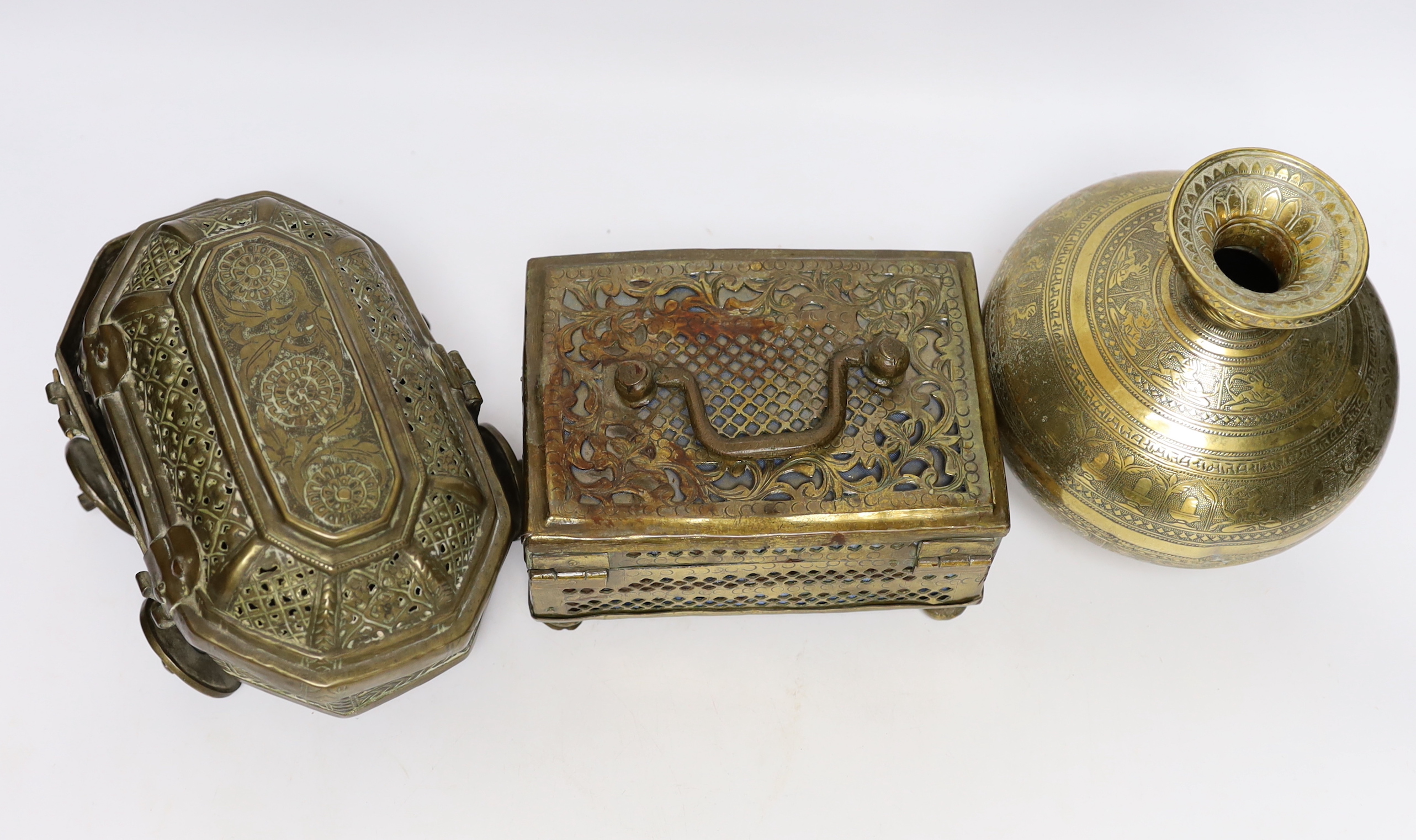 Eastern brassware to include a betel box on wheels, a vase with engraved detail and a pierced box, tallest 15.5cm (3)